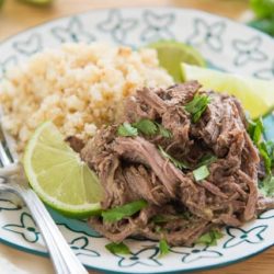 Shredded Beef - Cooked with Indian Spices and Plated with Cauliflower Rice, Chopped Cilantro, And Fresh Lime Wedges