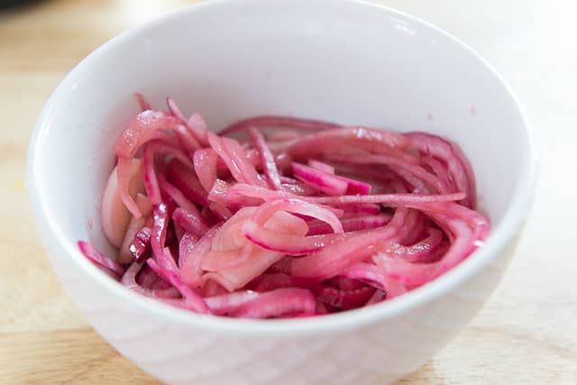 Quick Pickled Red Onions In White Bowl