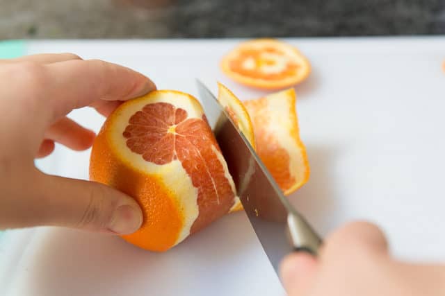 Segmenting a Cara Cara Orange, Cutting Off Rind With Chef's Knife