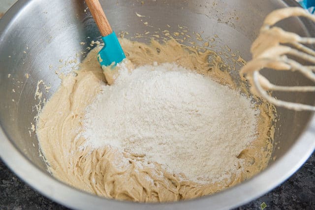 Flour Dry Ingredients On Top of Wet Ingredients In Bowl
