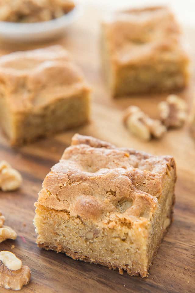 Blondies - Cut Into Squares and Plated on Wooden Board with Walnuts
