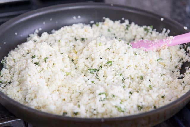 Cauliflower Rice Added to Pan with Herbs