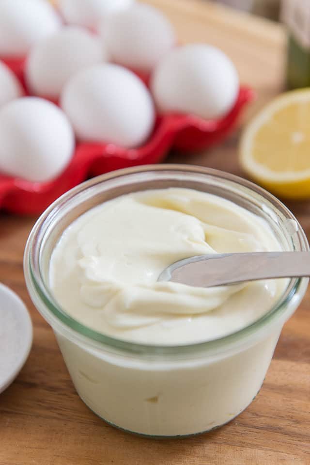 home made mayonnaise next to ingredients to make the recipe