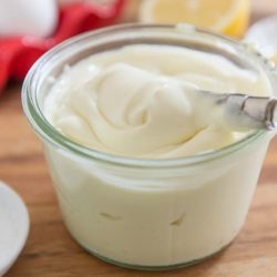 Homemade Creamy Whole30 And Paleo Mayonnaise In Glass Jar with Knife