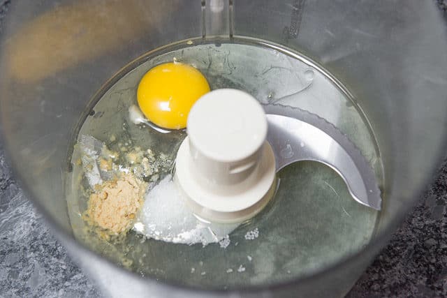 Egg, Dry Mustard, Oil, Salt In Food Processor Bowl For Homemade Mayonnaise