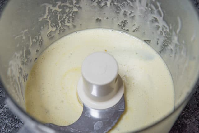 Blended Egg, Oil, Dry Mustard Powder, And Salt in Food Processor Bowl