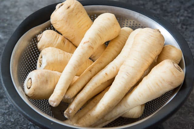 Parsnips in a Metal Colander for Washing