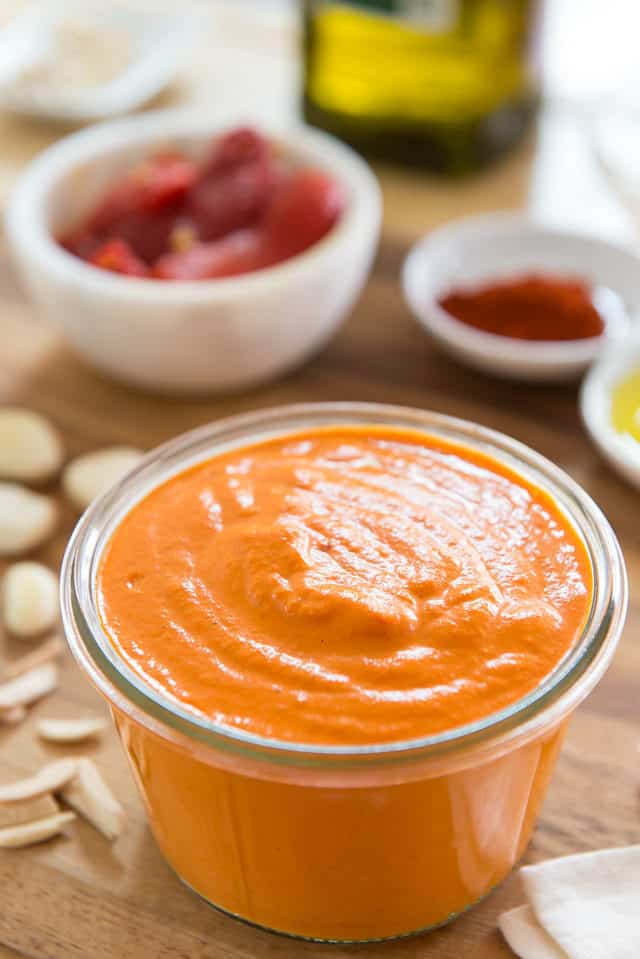 Romesco Recipe - In Short Glass Jar With Roasted Red Jarred Peppers, Smoked Paprika, Garlic, and Almonds