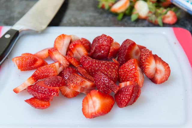 Freshly Sliced Strawberries on cutting Board