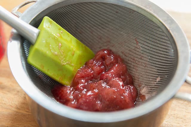 Straining Strawberries Out with Fine Mesh Strainer