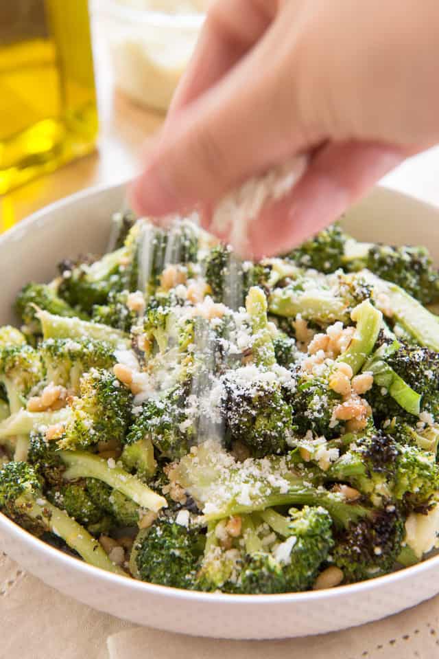 Adding cheese over Broccoli Side Dish with pine nuts