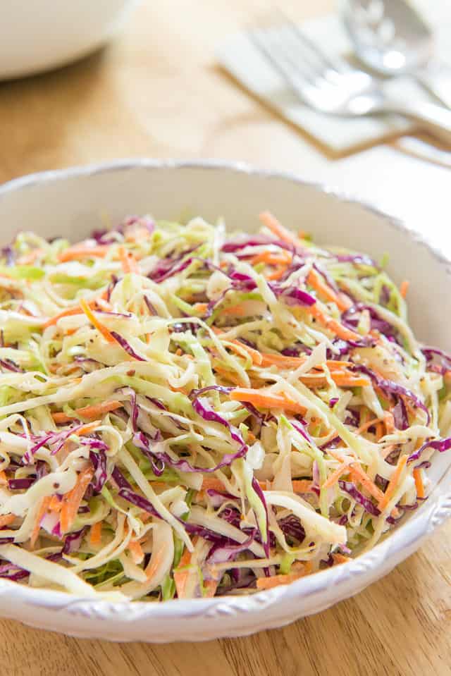 Coleslaw - with Shredded Green and Purple Cabbage and Carrots in White Bowl
