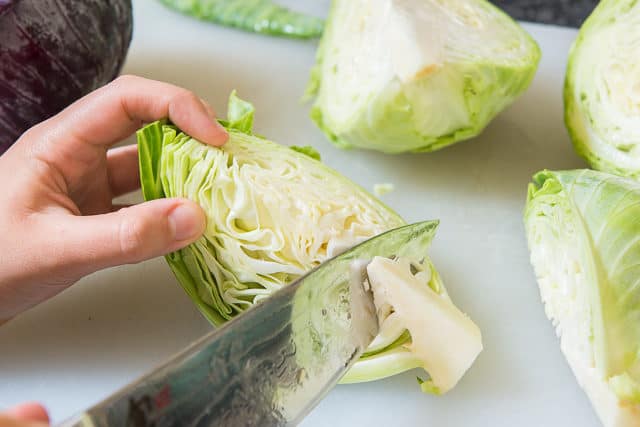 Cabbage Cut into Quarters and slicing out Core