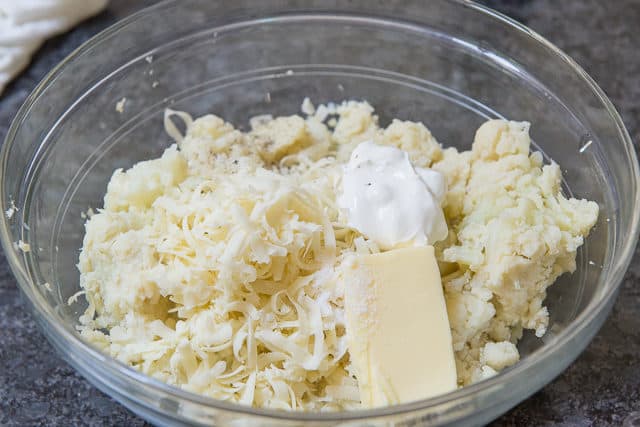 Cauliflower Mash in Glass Bowl with Cheese, Sour Cream, and Butter Added