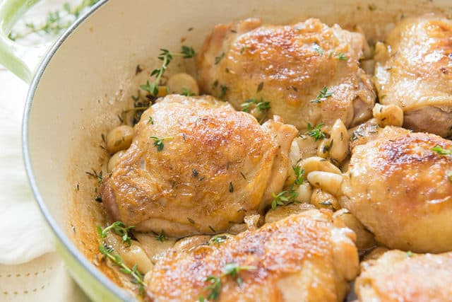 40 Garlic Chicken - Served in a Green Braiser Dish with Thyme Sprigs