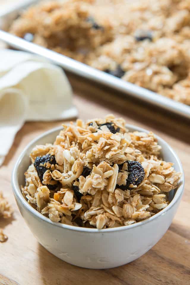 Granola Recipe - Served In a Gray Bowl on Wooden Board with napkin