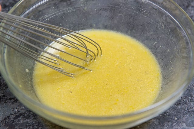 Lemon Mustard Vinaigrette - In a Glass Bowl with Whisk