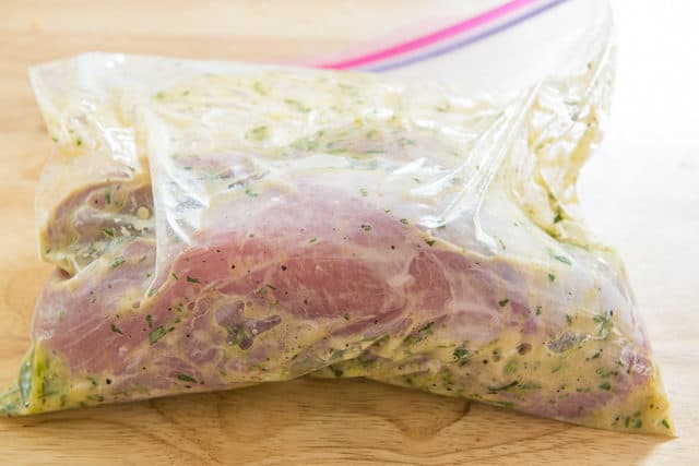 Plastic bag with pork tenderloins and marinade inside - Pork Tenderloin Recipes Oven
