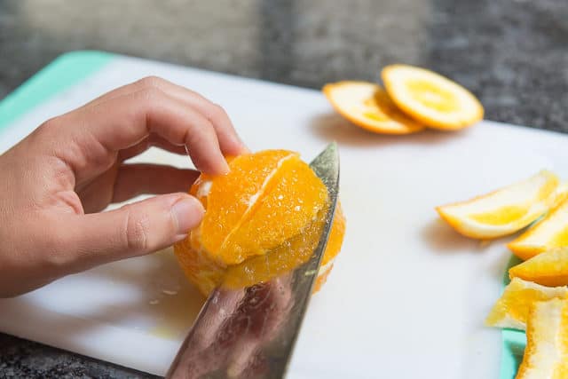 Slicing Against Membrane on Both Sides of Orange
