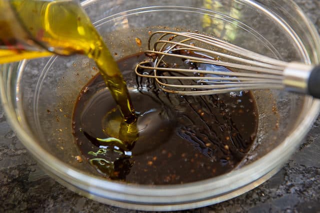 Pouring Olive Oil Into the Bowl