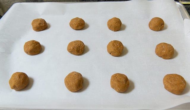 Chewy Molasses Cookie Dough balls on Parchment