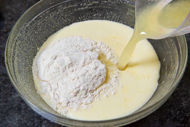 Pouring Lemon Juice Into Filling Bowl with Flour
