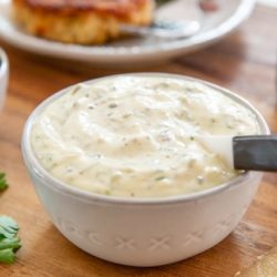 Tartar Sauce In a white Bowl with Spoon on Wooden Board