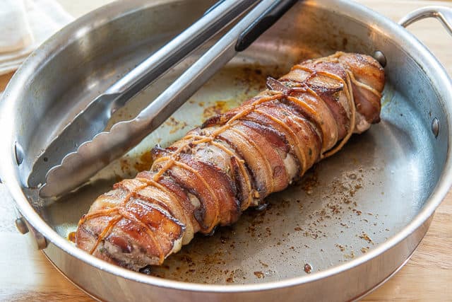 Bacon Wrapped Pork Tenderloin Recipe - Served in Stainless Steel Skillet Tied