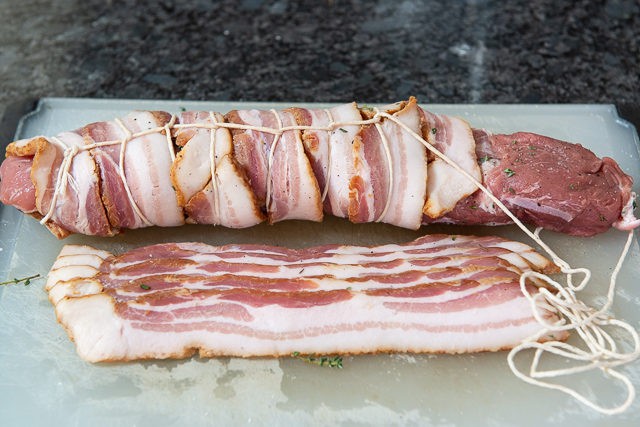 Tying Bacon Around Pork Tenderloin with Kitchen Twine