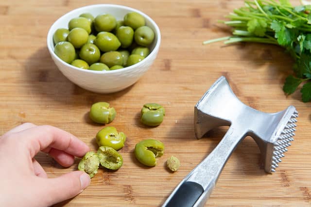 Pitting Green Olives by Smashing with meat Mallet