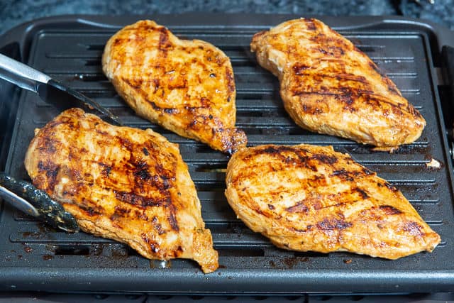 Marinated Chicken Breast on Grill with Grill Marks