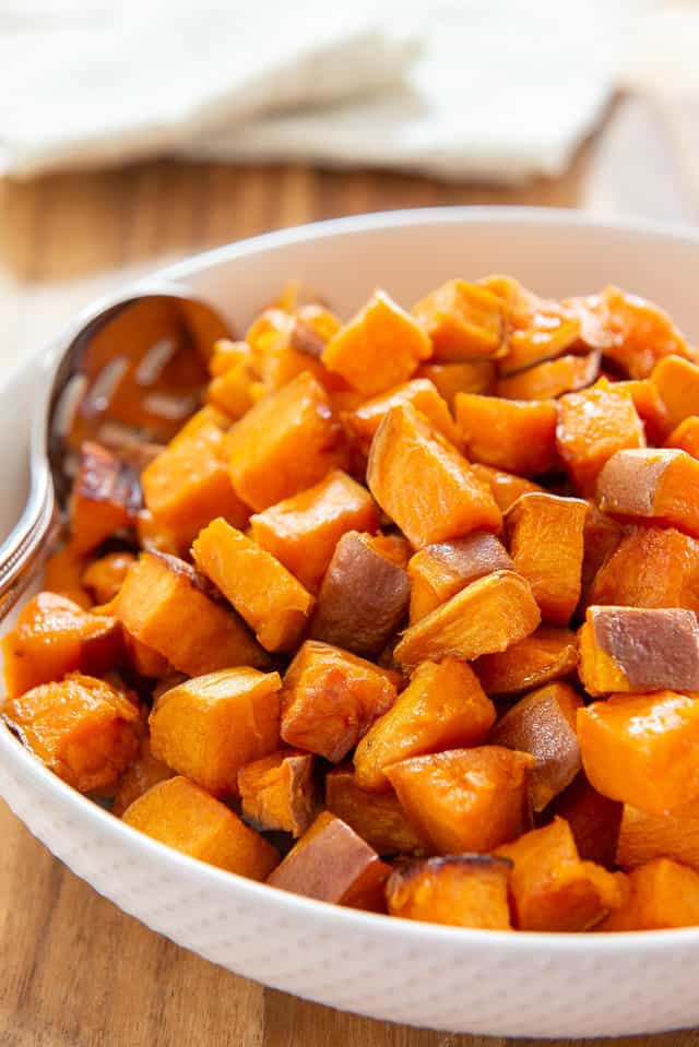 Roasted Sweet Potatoes - In a White Bowl with spoon