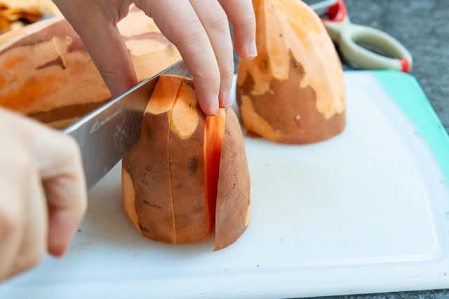 Cutting Sweet Potato Into Slices on board