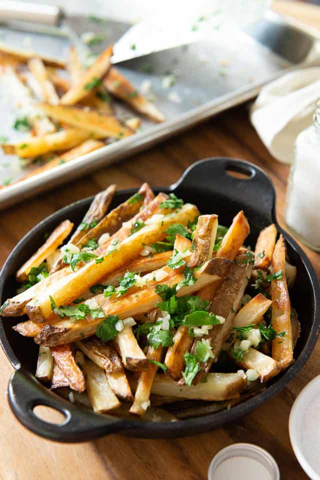 Garlic Fries Recipe - Served in Cast Iron Dish with Parsley 