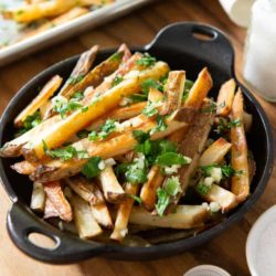 Garlic Fries In cast Iron Dish with Garlic and Parsley
