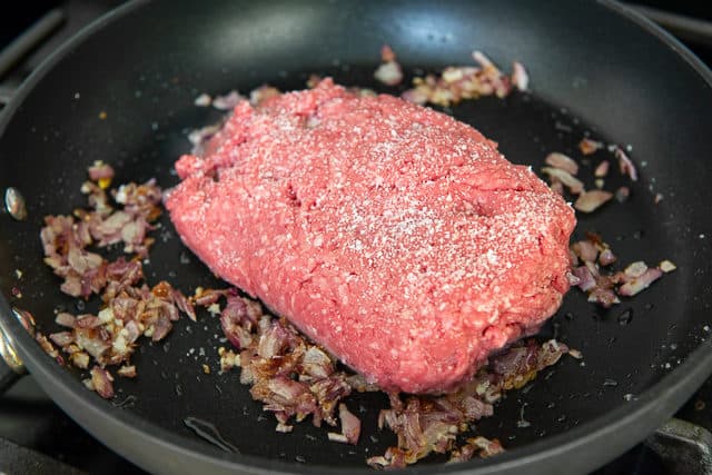 Brick of Ground Beef Added to Skillet
