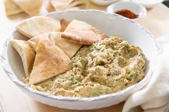 Best Baba Ganoush Recipe - Served in White Bowl with Pita Wedges