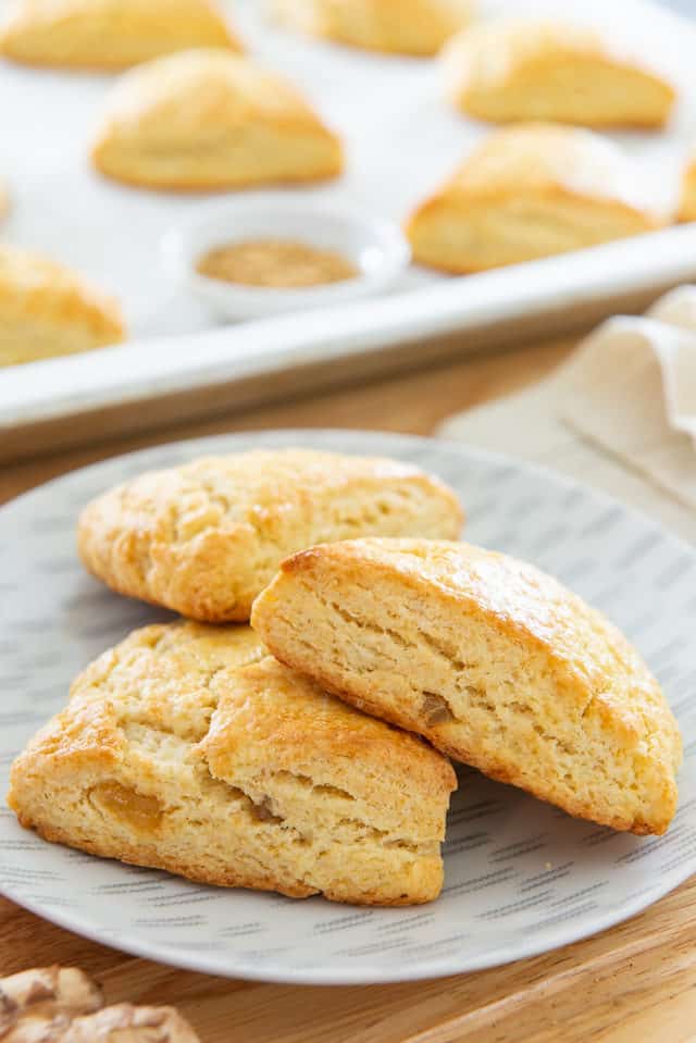 Ginger Scones - with Crystallized Ginger Pieces and Cream on a Grey Plate