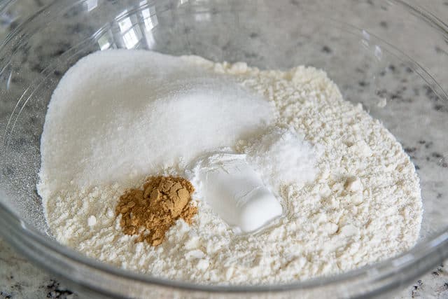 Ground Ginger, Sugar, Flour, Baking Powder, and Salt in Glass Bowl
