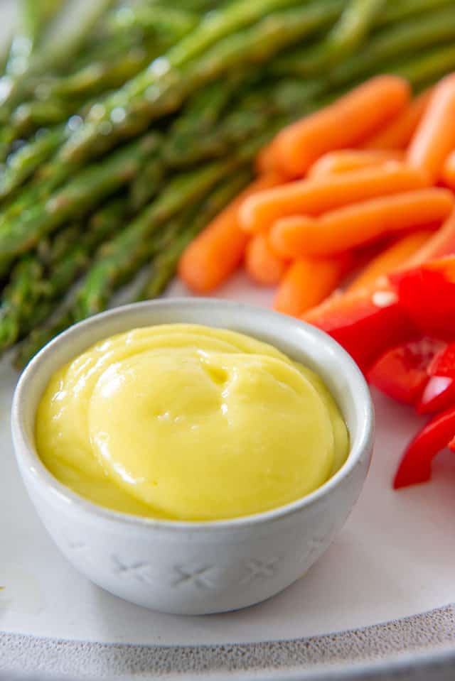 Aioli - Shown in Ramekin with Dipping Vegetables on Side (Asparagus, Carrots, and Bell Pepper)