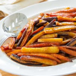 Roasted Carrots Served on White Platter with Spoon