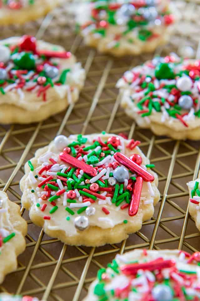 Sugar Cookie Recipe - Shown With soft cookie base, simple buttercream frosting, and festive sprinkles