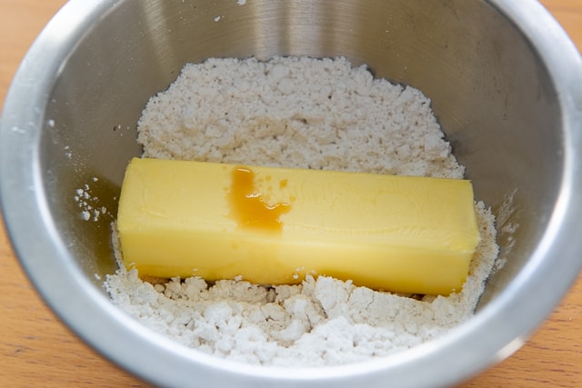 Vanilla Buttercream - Butter, Confectioner\'s Sugar, Milk, and Vanilla Extract in Bowl