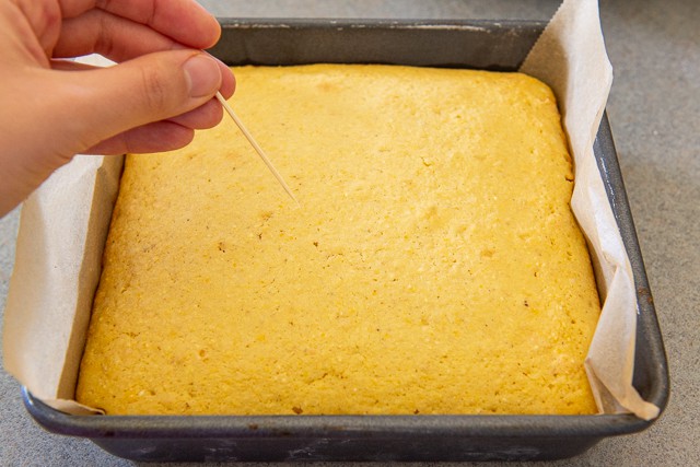 Sweet Cornbread Recipe - Shown Baked in 8x8 Pan Until Toothpick Comes Out Clean