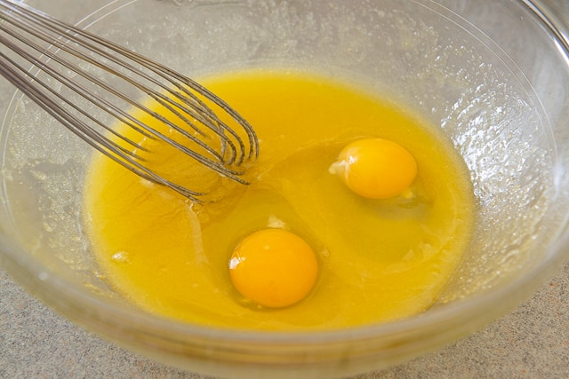 Two Eggs Added to Melted Butter and Sugar with a Whisk