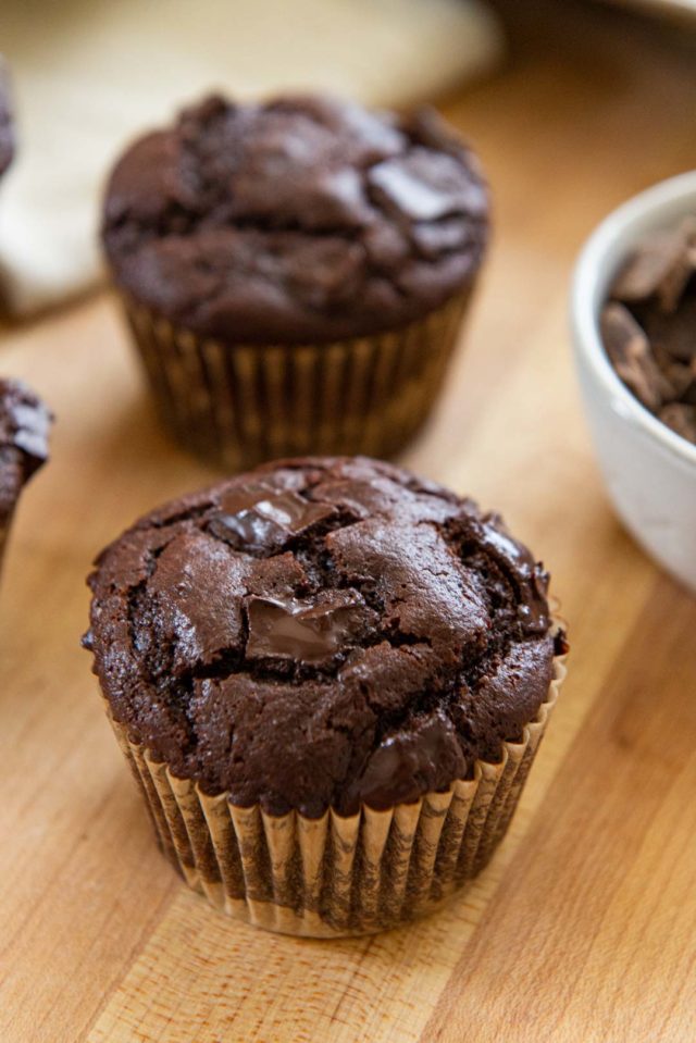 Chocolate Muffins - On a Wooden Board with Bowl of Chocolate Chips