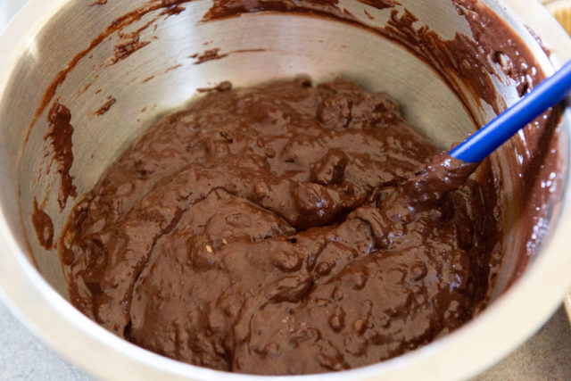 Chocolate Muffin Batter - in Mixing Bowl with Blue Spatula