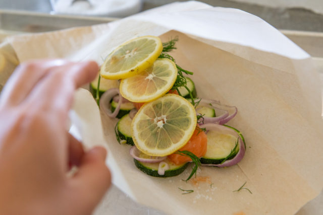 Baked Salmon in Parchment Bag with Lemon Slices, Dill, Shallot, and Zucchini