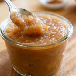 Crockpot Applesauce Made in Slow Cooker In Jar with Spoon