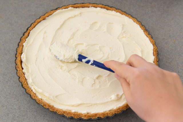 Filling the Graham Cracker Pie Crust with Mascarpone Using Spatula